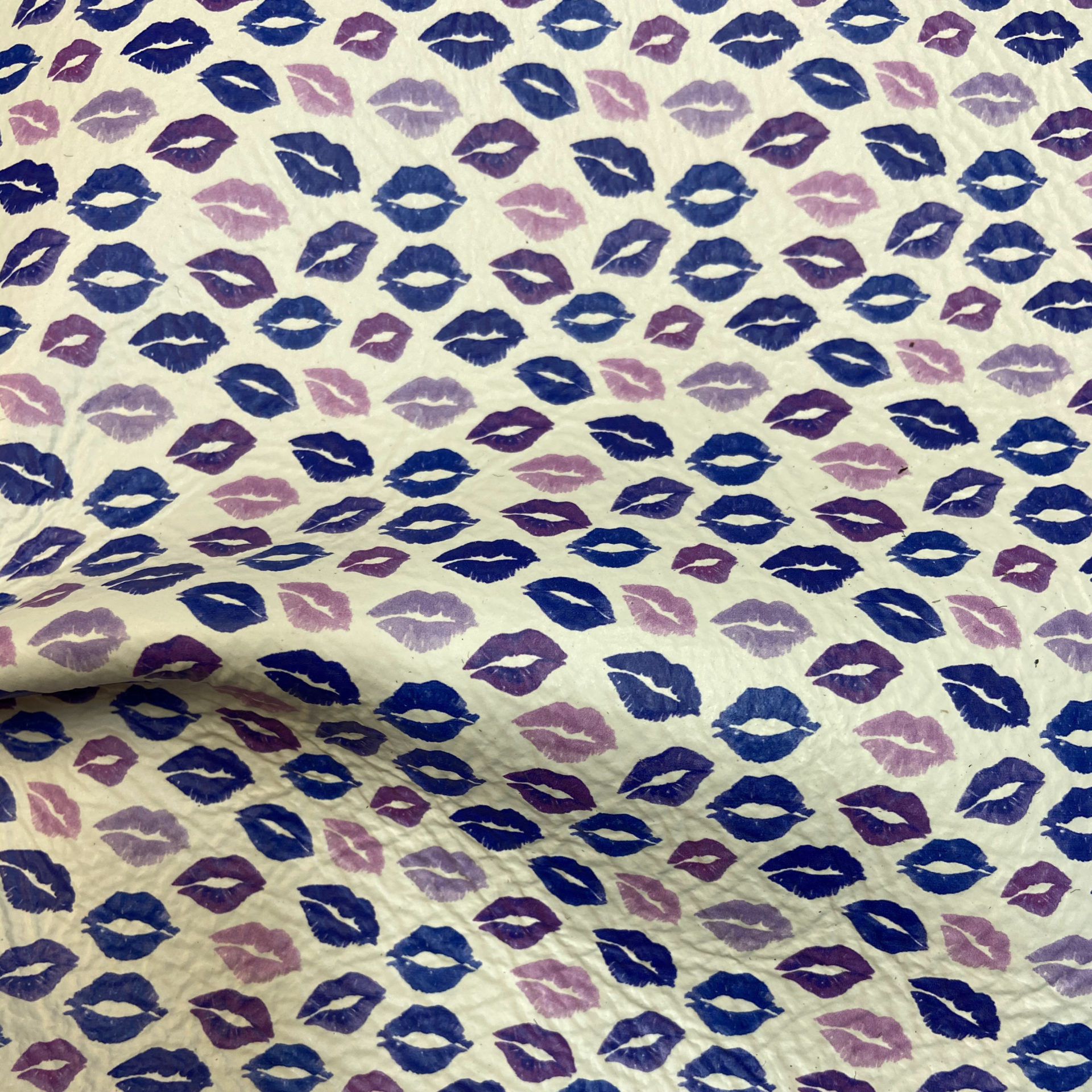 Mini Blue Kisses on White Background on White Leather - Rainbow Leather